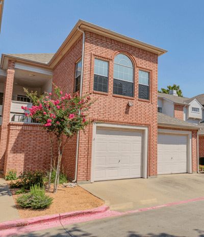 Red Brick Home with Flowering trees