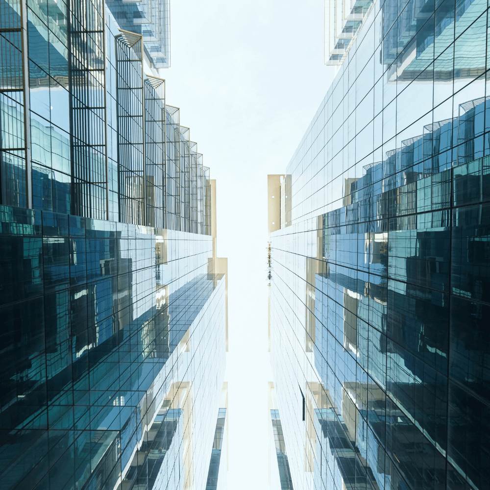 Abstract view looking up towards glass multifamily skyscraper