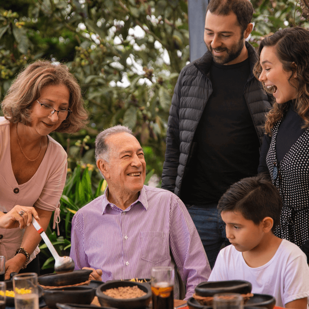 A family gathered outside for a meal