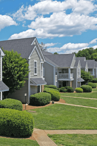 Row of homes with green lawns